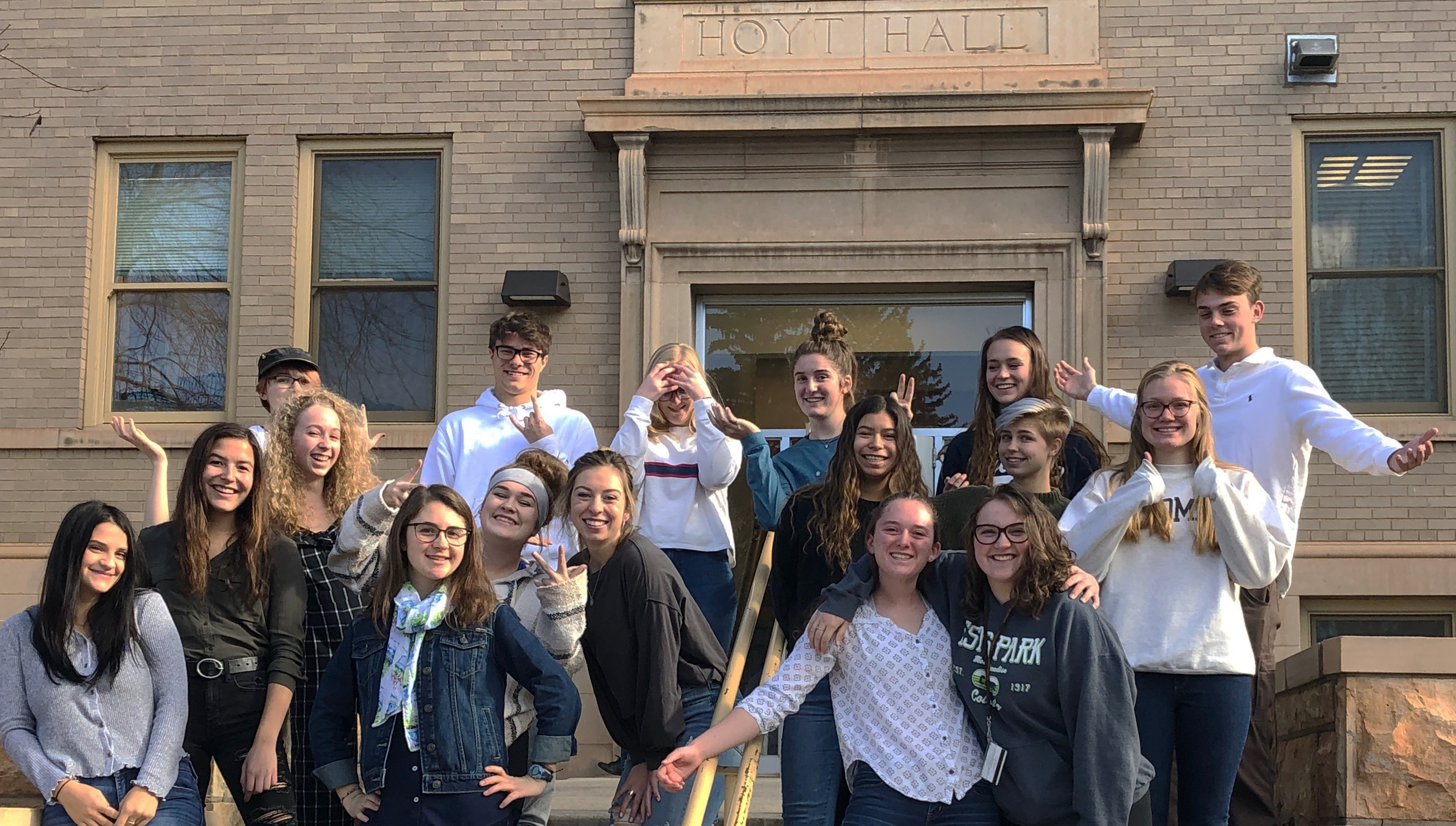 students pose in front of Hoyt Hall on the University of Wyoming Campus