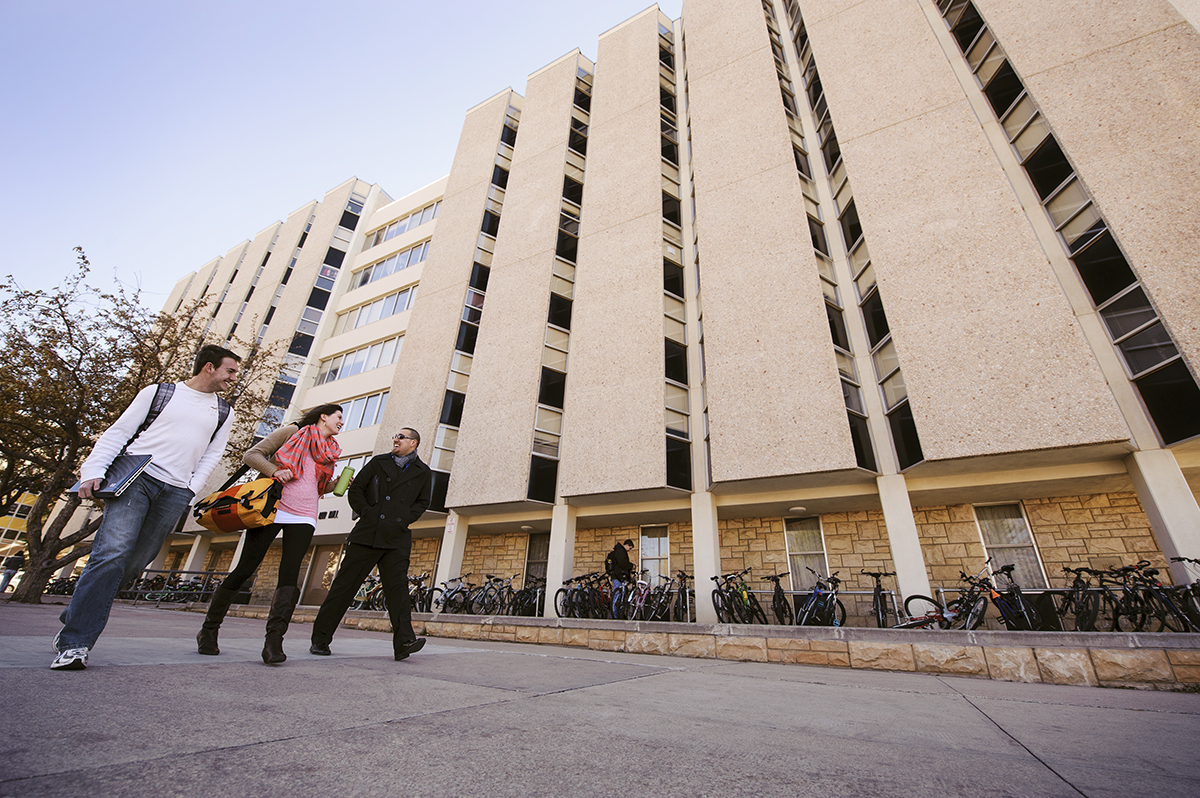 image of residence halls with students walking to classes at the University of Wyoming