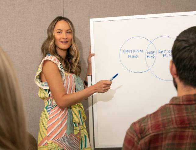 a woman gives a University Counseling Center presentation