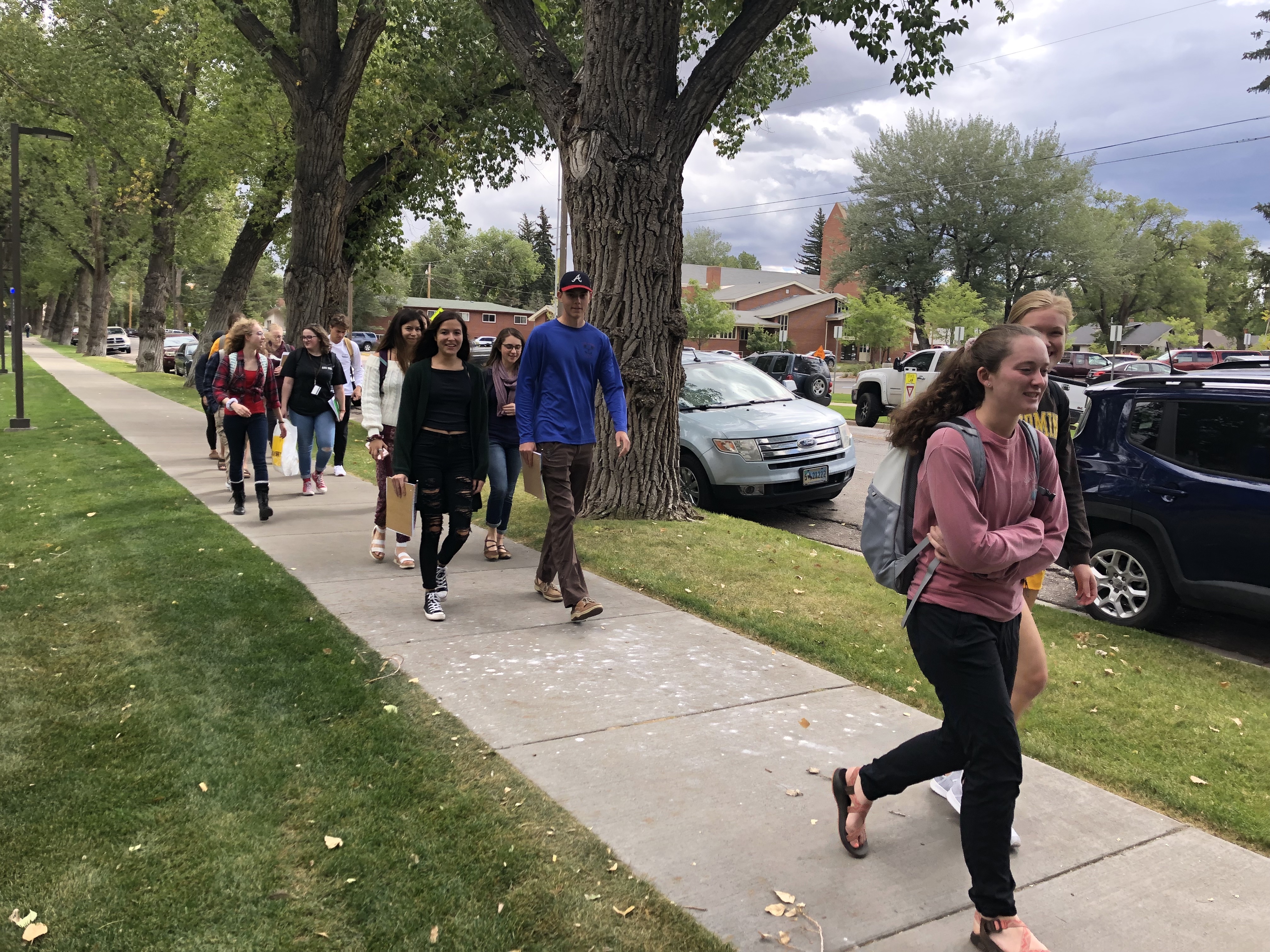 Students walk to the Big Hollow Food Coop to conduct food studies research