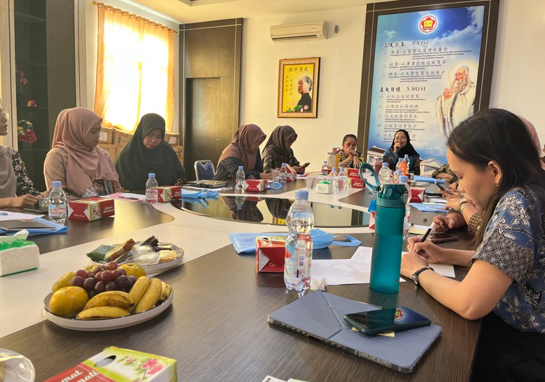 faculty writing during a workshop