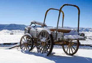Image of a covered wagon in the snow located near Casper