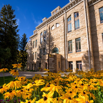 Old Main with flowers in foreground