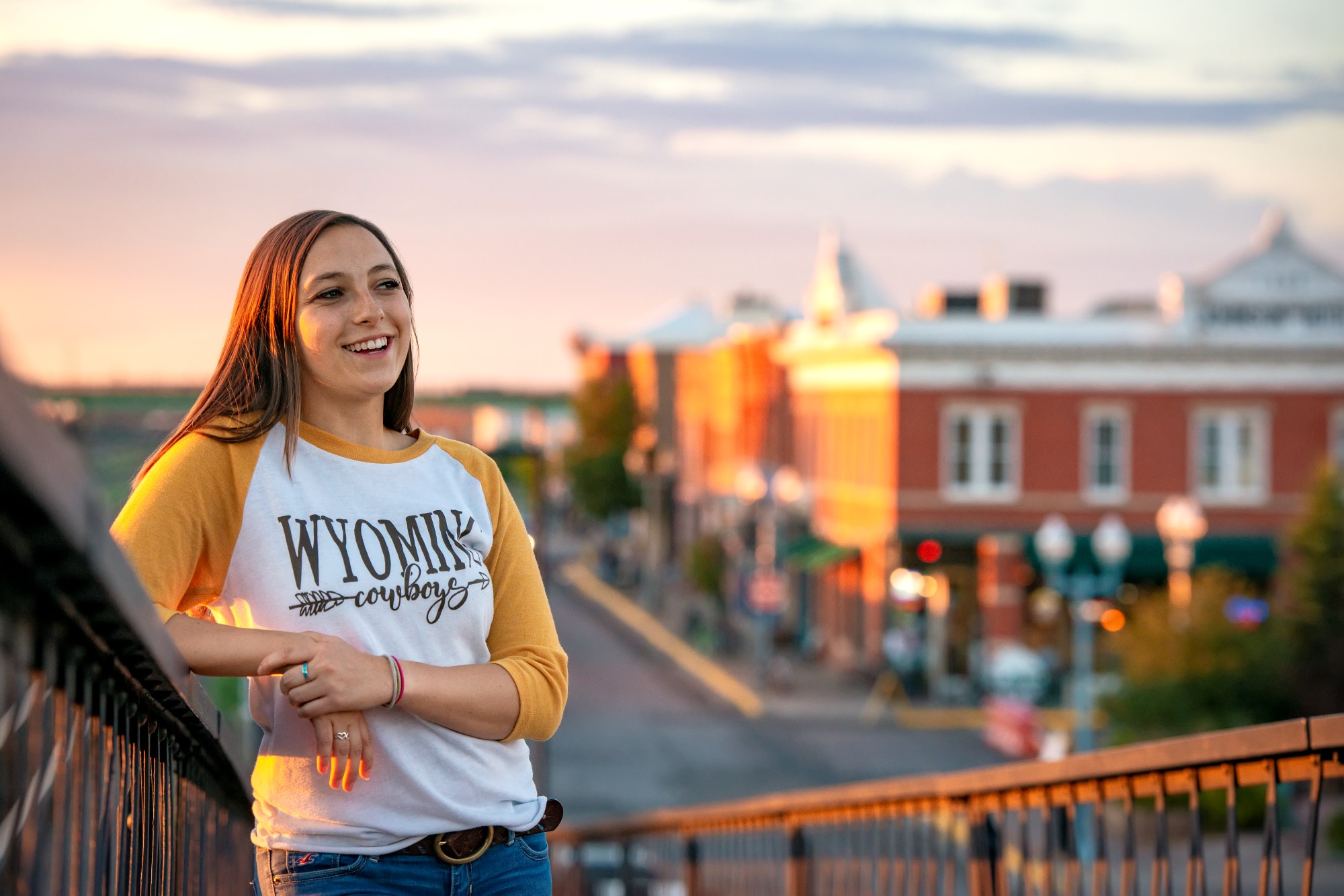 a woman standing on a bridge