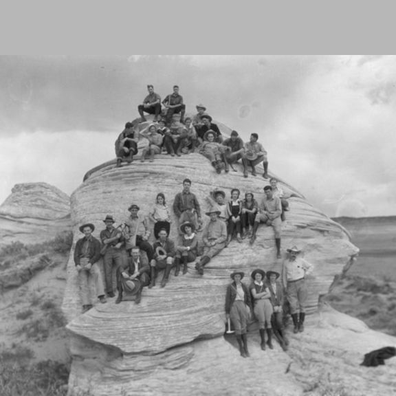 Old photo of Geologists posing for a picture on a rock formation