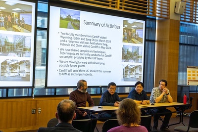 faculty presenting in front of screen