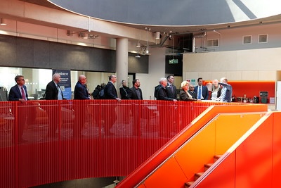 group touring building with orange stairs