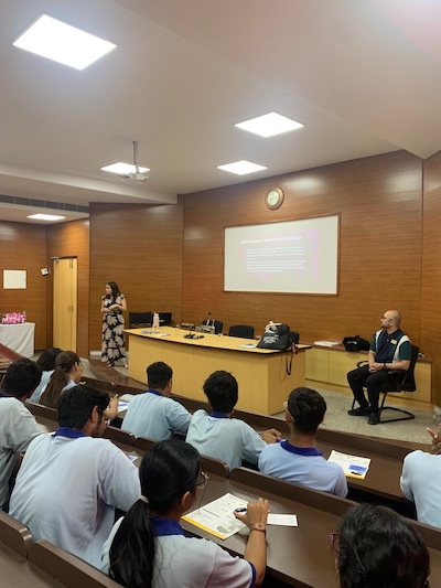 Daing listening at a presentation
