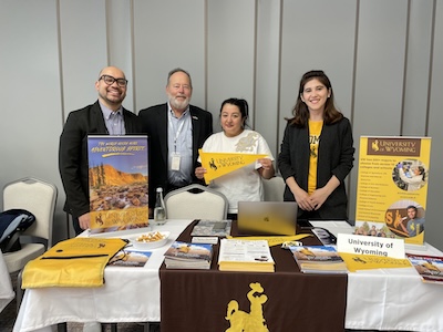 Daing and alumni/presenters at a booth