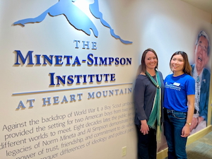 Haruka Takaku and Aura Newlin in front of Mineta-Simpson Institute sign