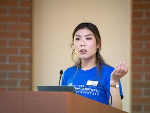 Haruka Takaku speaking at a podium