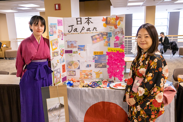 Yuki with a Japanese Conversation Club student at International Education Week