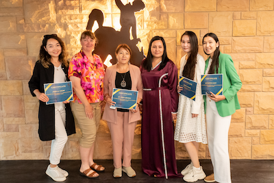 Karlyga Myssayeva, Cindy Price Schultz, and Dilnoza Khasilova with Kazakhstan students