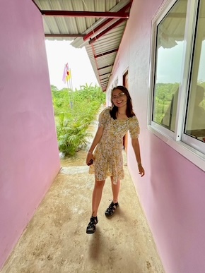 Jess Petri in front of School in Burmese 