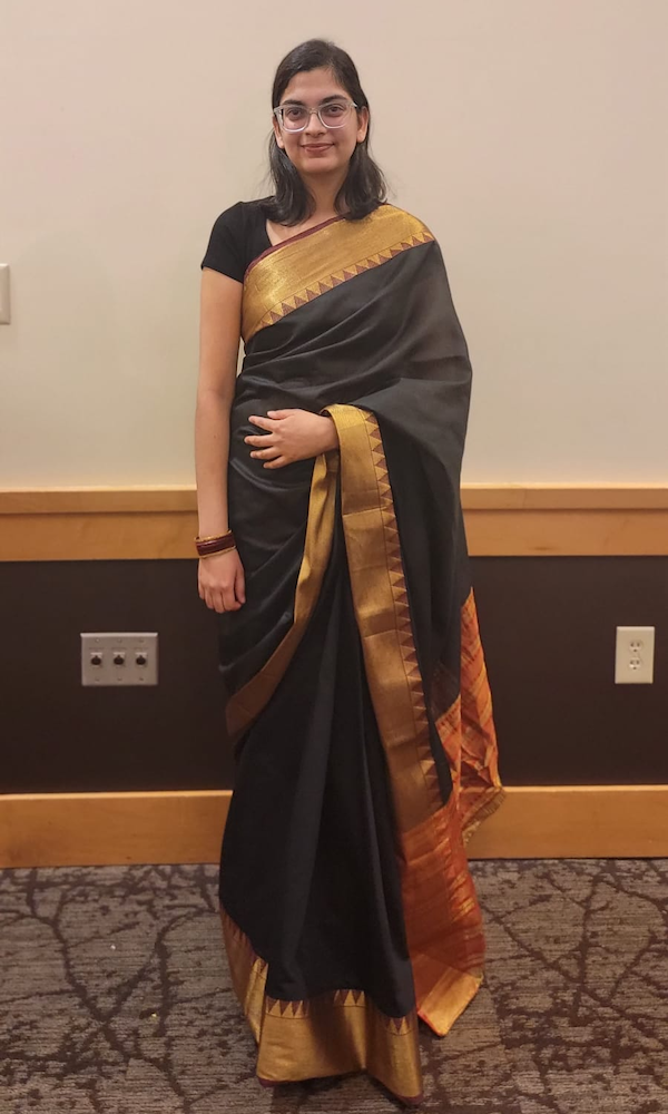 Megha Singh smiling at camera