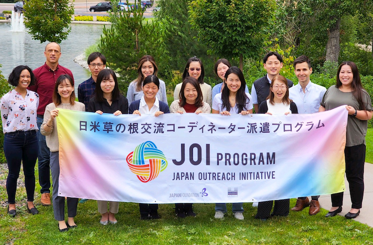 JOI coordinators holding sign