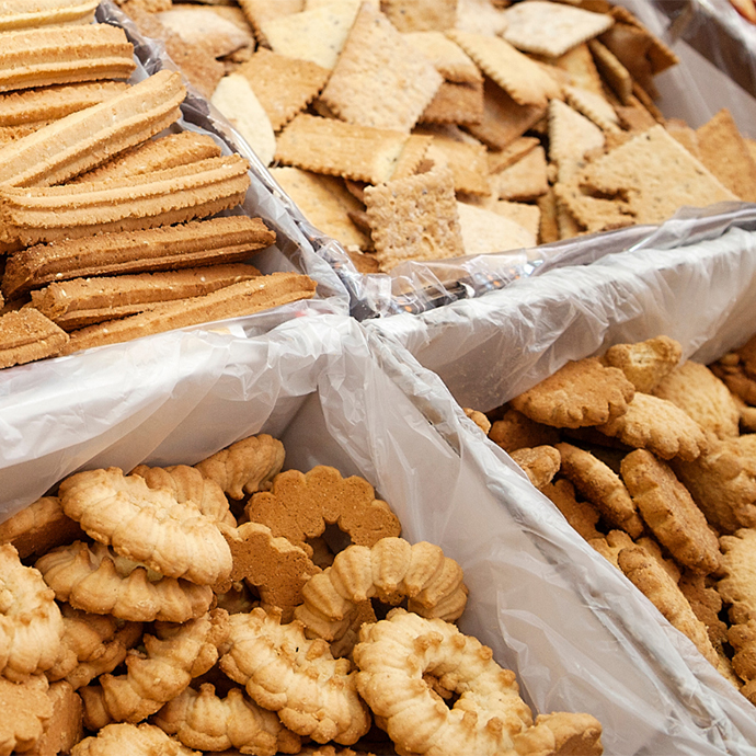 Four bins of cookies are on display in a Jerusalem market.