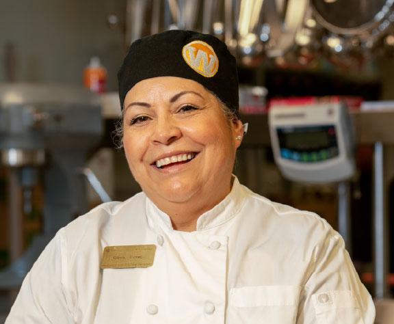 Food service employee smiling