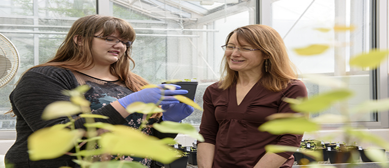 female-teacher-student-in-greenhouse-767.jpg