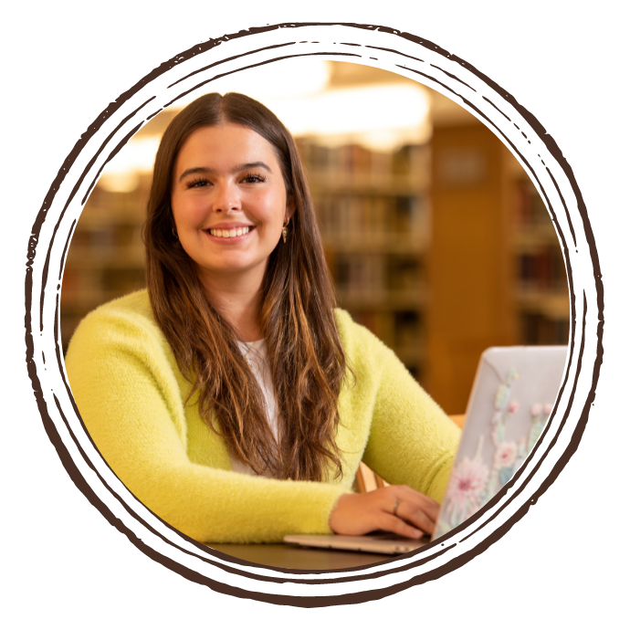 Student smiling in library