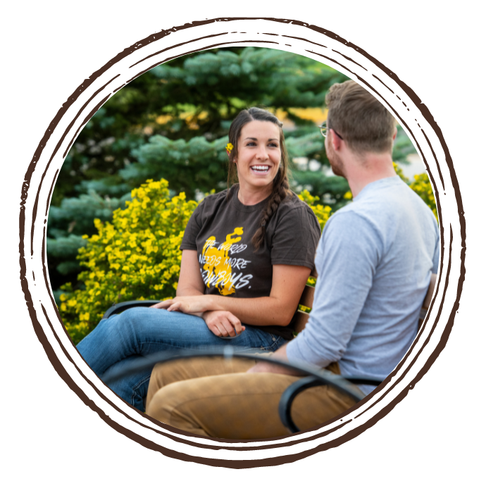 Two students sitting on bench