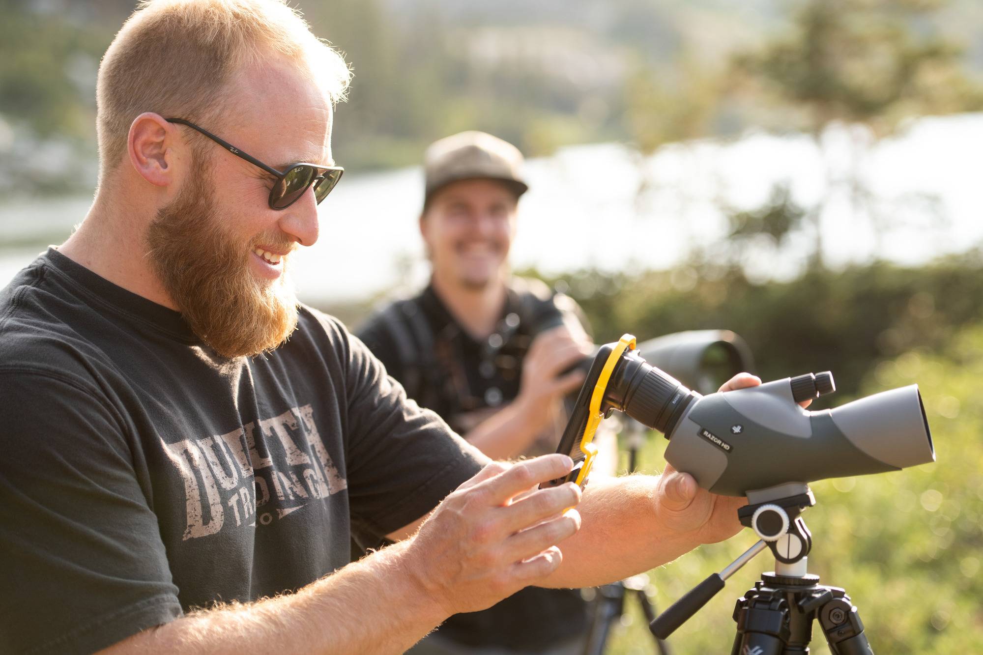 Haub School faculty uses a camera