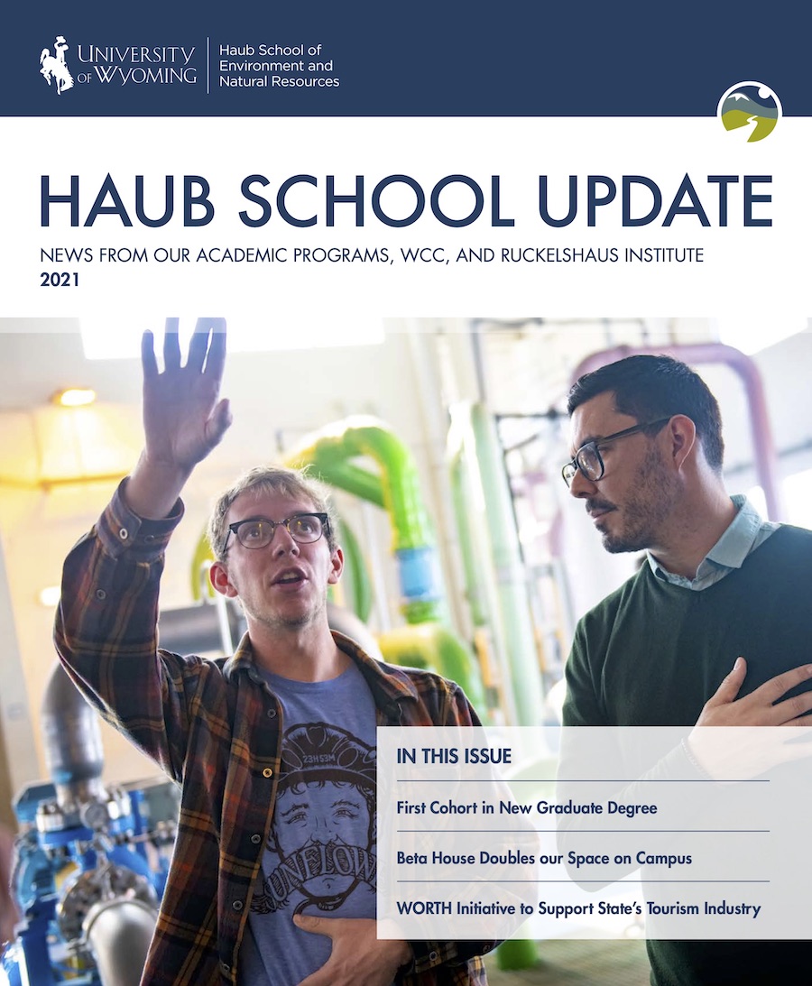 Cover of Haub School Update 2021 with image of two men in a water desalination plant.