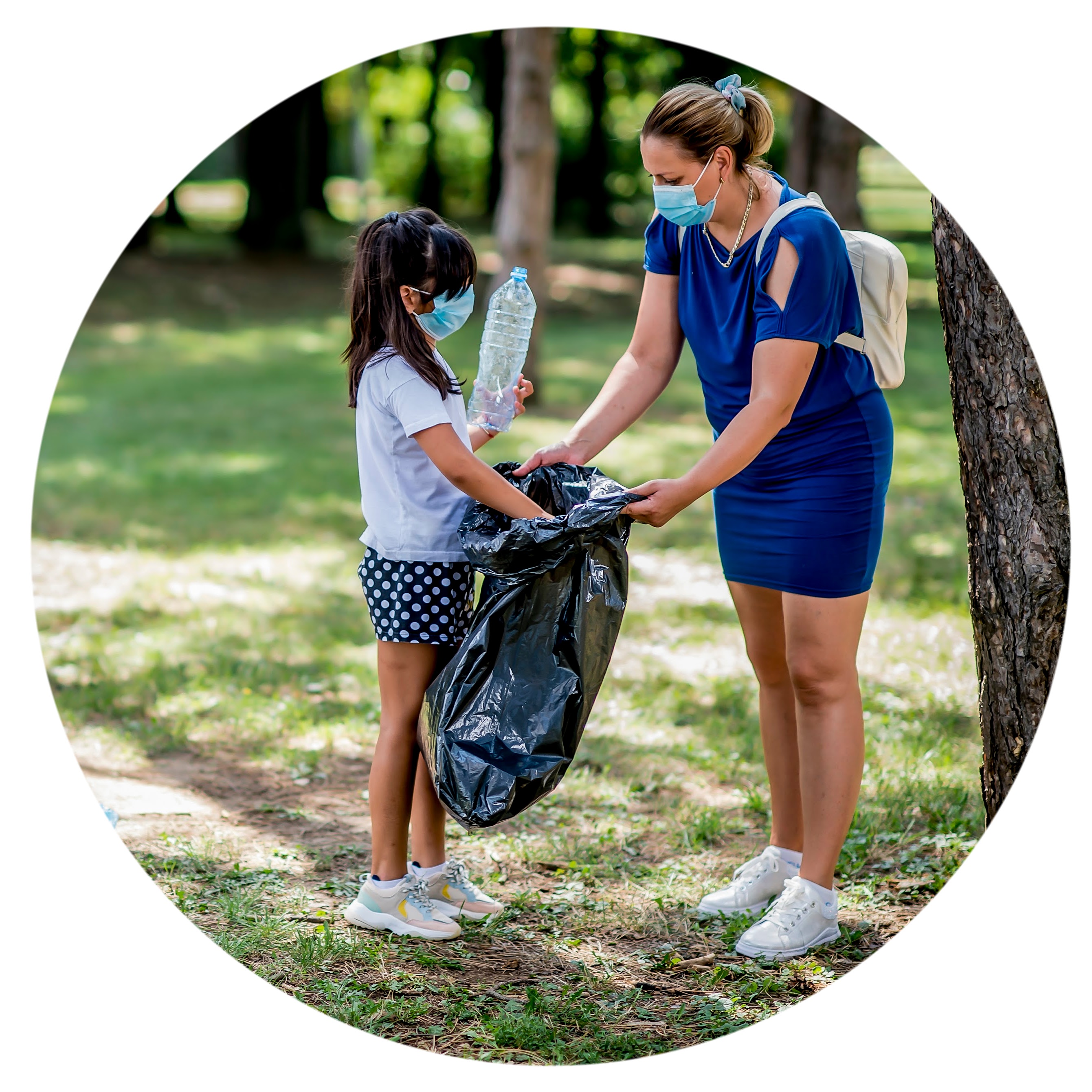 two people pick up trash outside