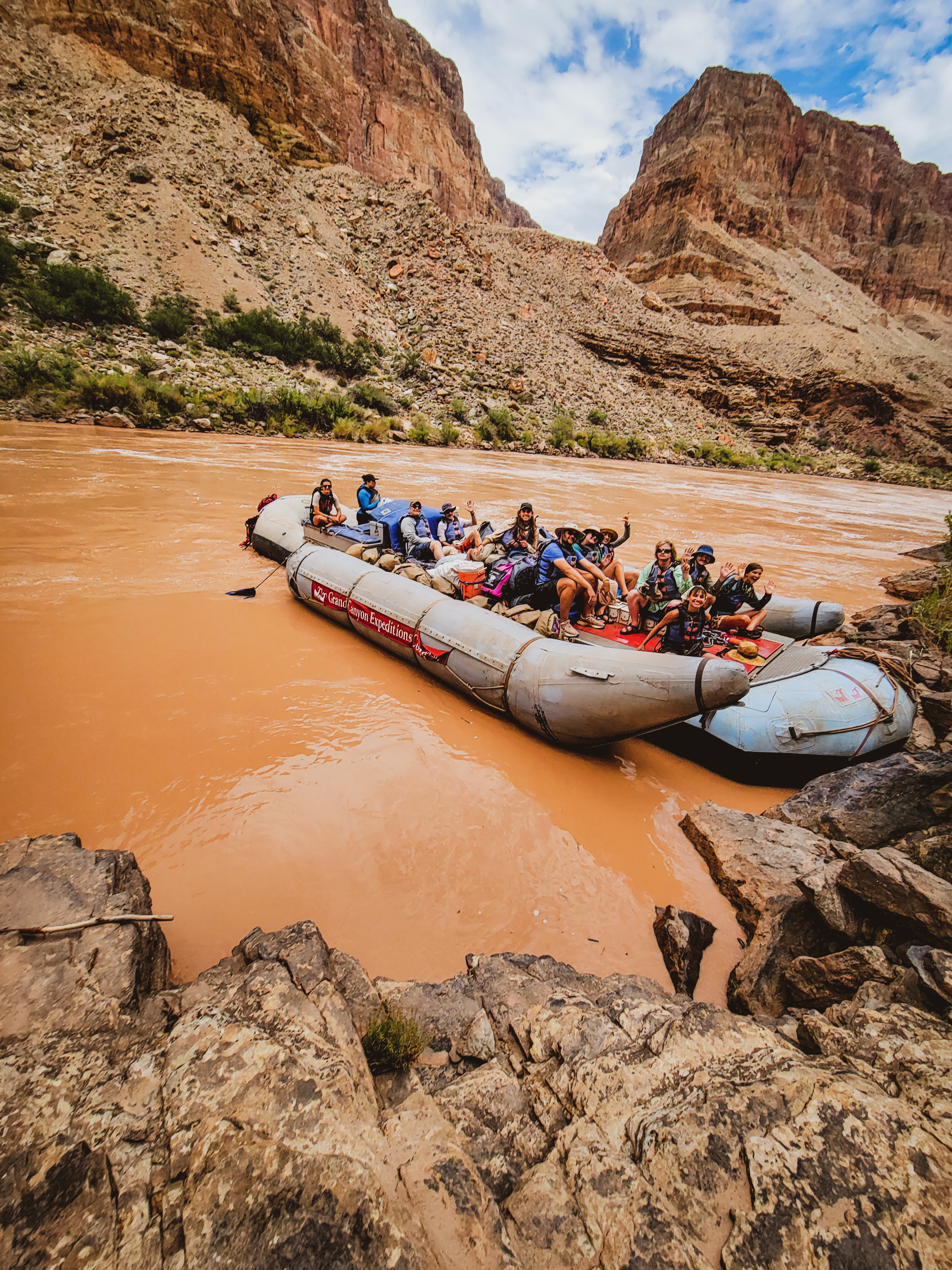 a group of students on a motor boat in the Grand Canyon