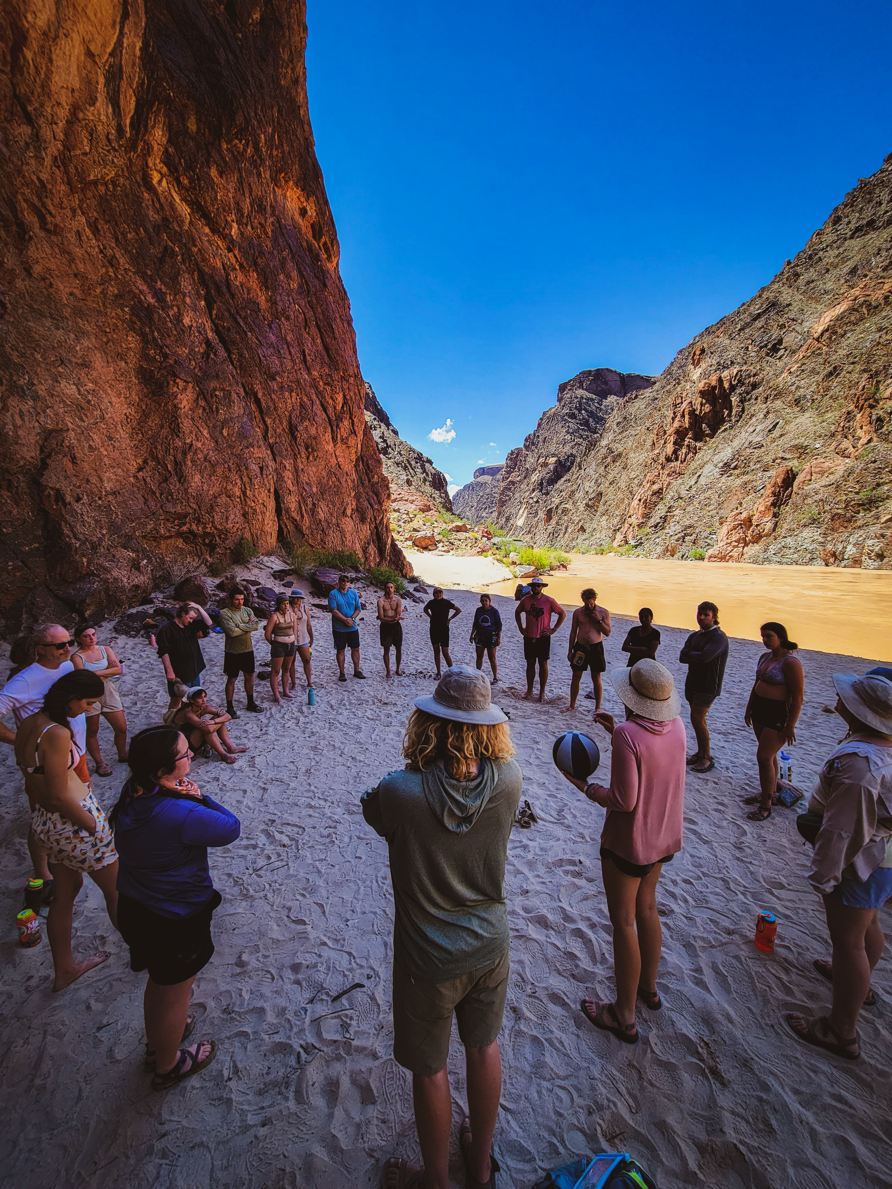 students having group discussion in desert landscape