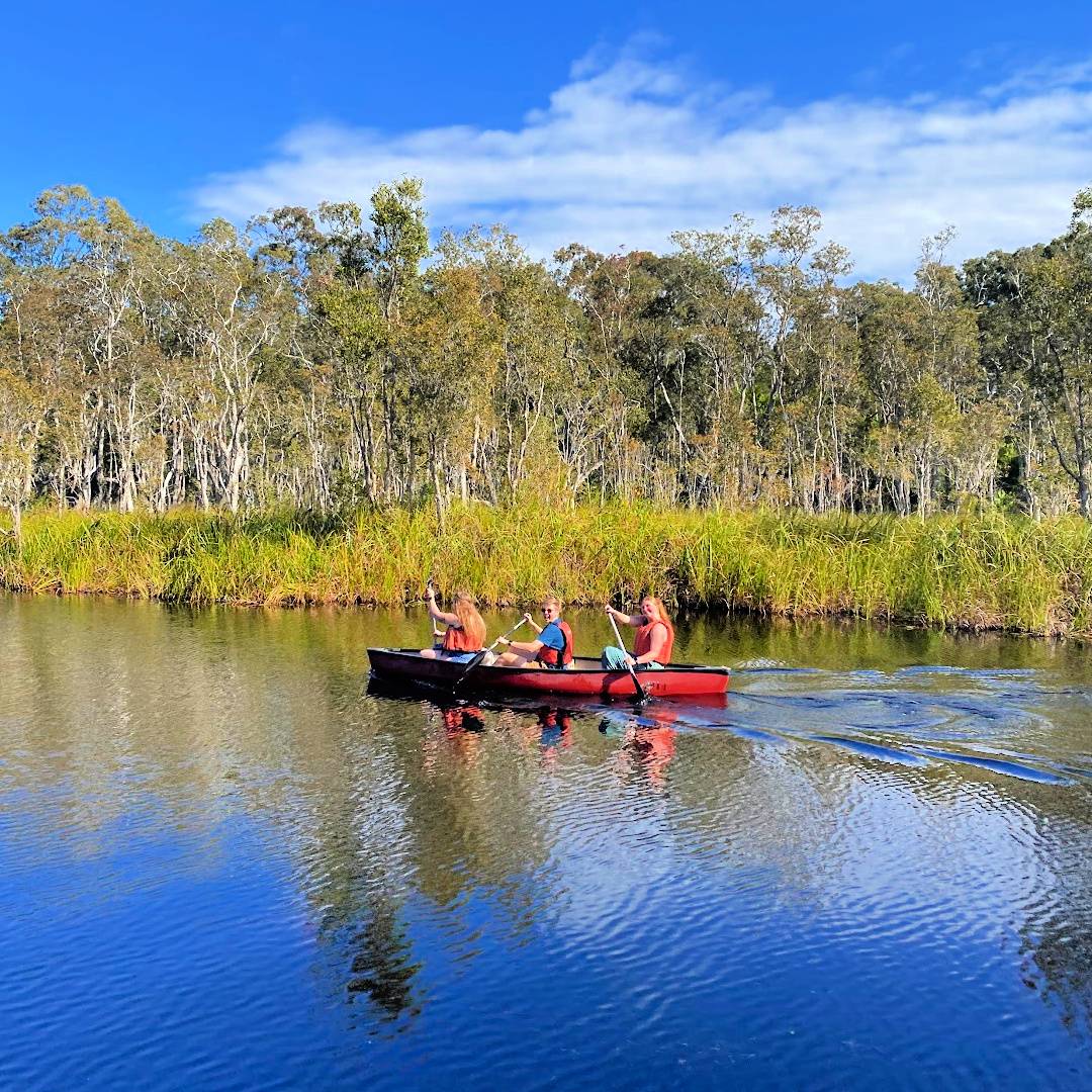 3 people in a canoe