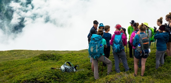 students in mountain landscape