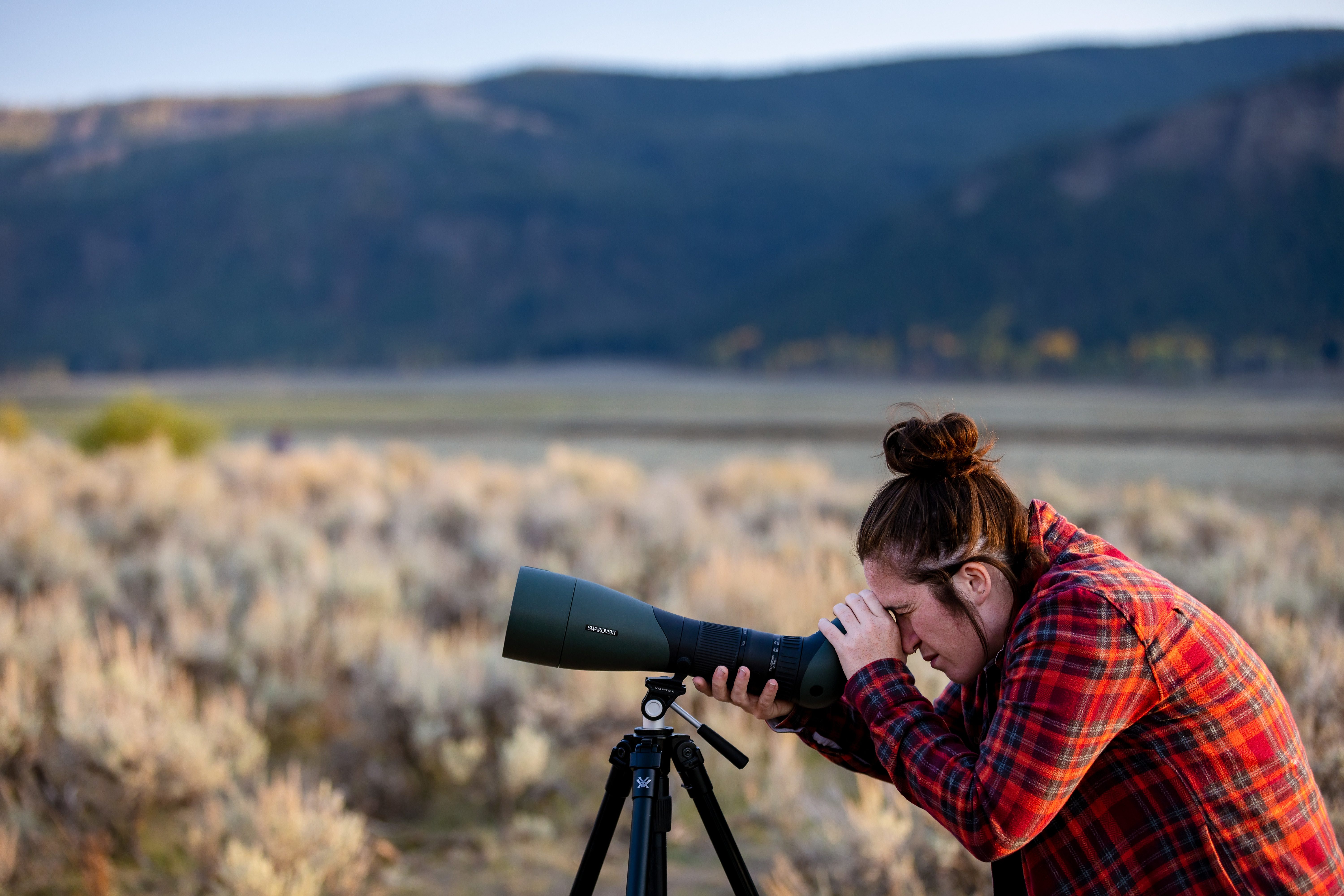 woman using scope outdoors