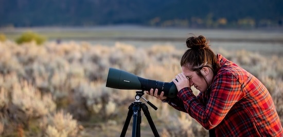 student looking through scope