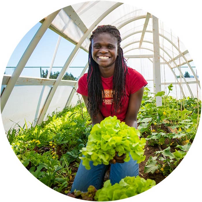 Student holding lettuce