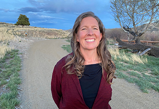 A headshot of Melanie Armstrong