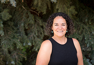 A headshot of Temple Stoellinger