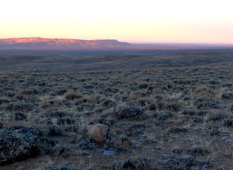 Sagebrush and buttes in southwest Wyoming at sunset.