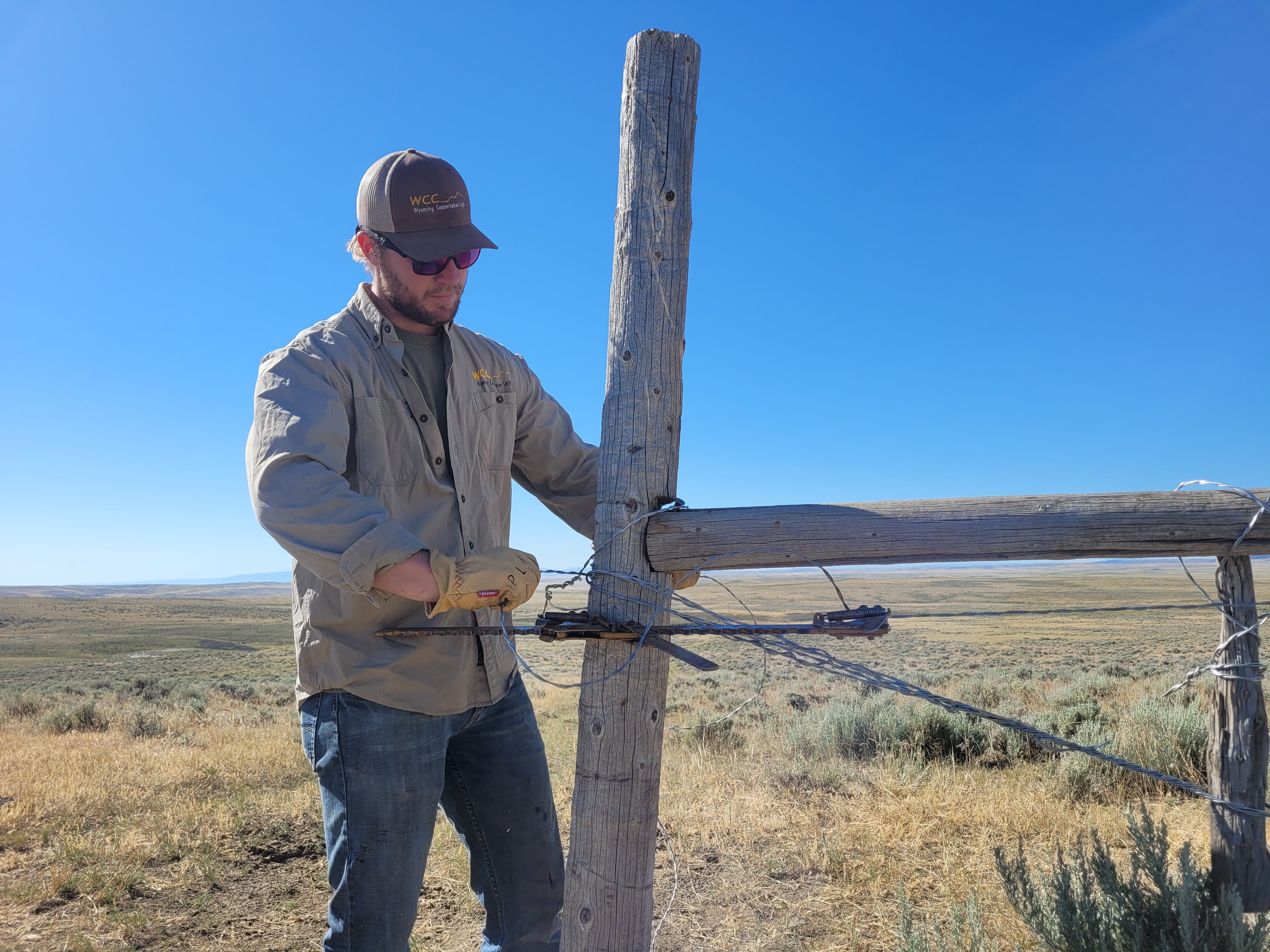crew leader building a fence