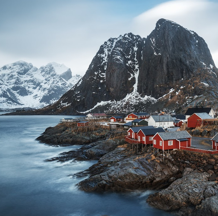mountain with red buildings in the foreground