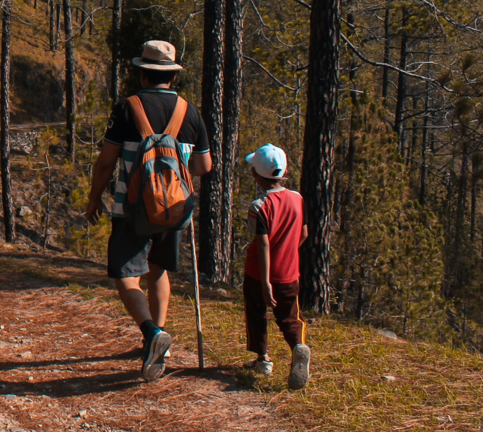 man and kid hiking
