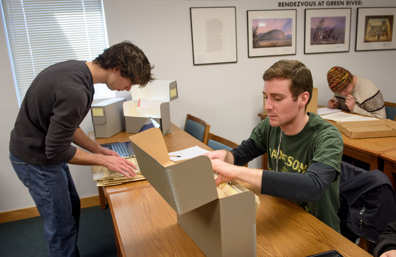 Photo of students doing archival research