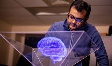 Student looking at a virtual model of the brain