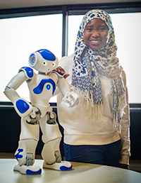 woman standing with robot
