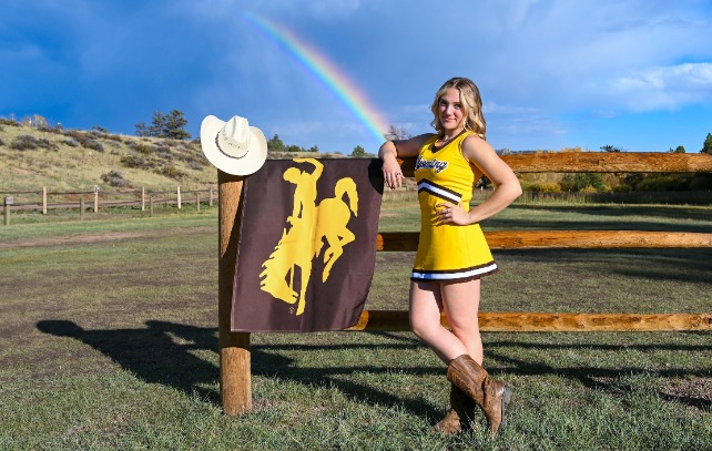 Allie Robert with Wyoming Flag, Cowboy hat, and Rainbow