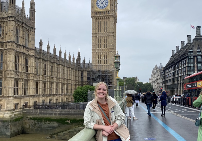 Annalise Gade stands in front of Big Ben in London.