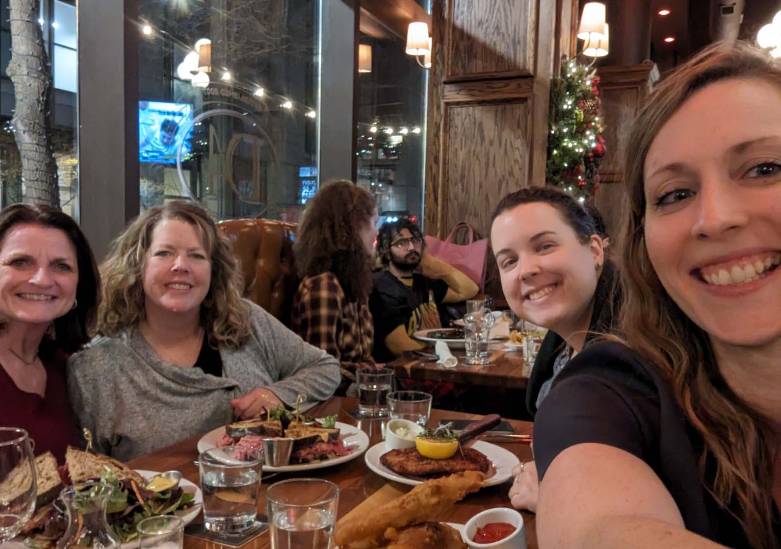 Breezy, Laura, Mimi (former faculty) and Mandie at a restaurant in Chicago at the National Honors College Conference in 2024.