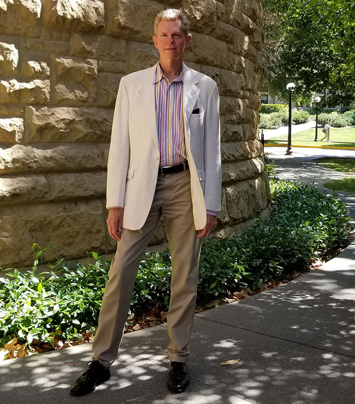 man standing on a sidewalk