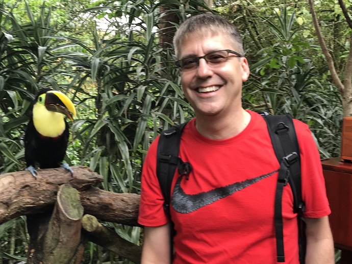 Kem Kruger standing next to a bird