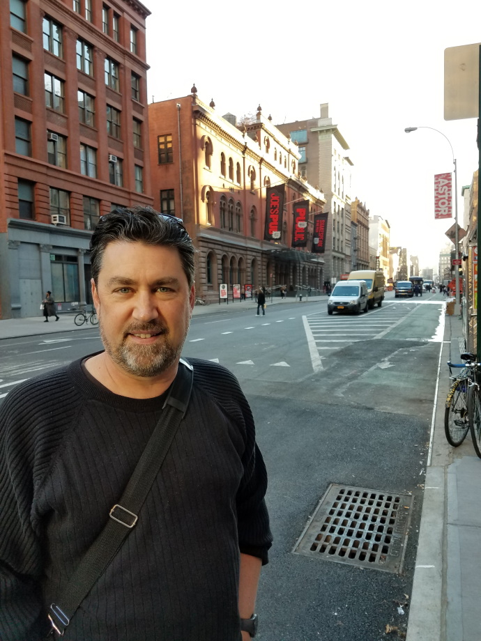 Leigh Selting posed in front of a cityscape